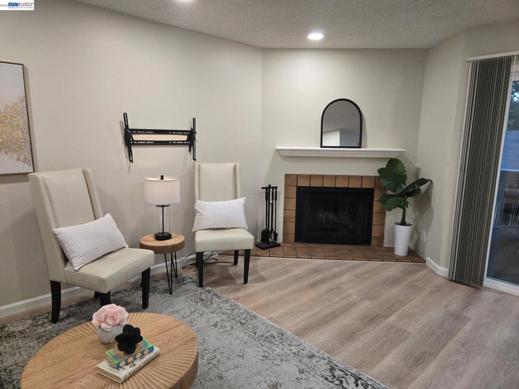 Fireplace, new luxury panel flooring, new paint and recess lights in the family room