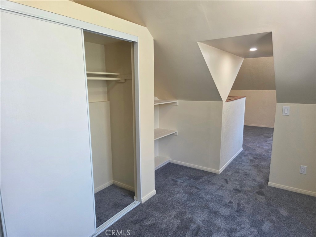 Closet in loft bedroom