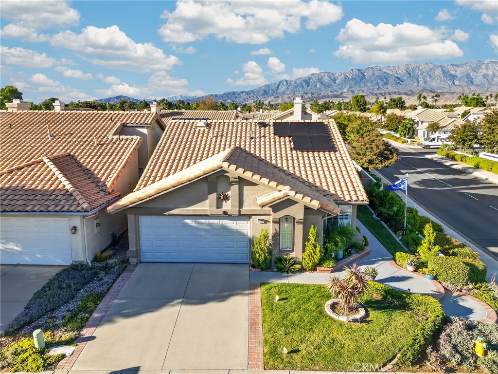 Overhead View of Home with Mountains in Background