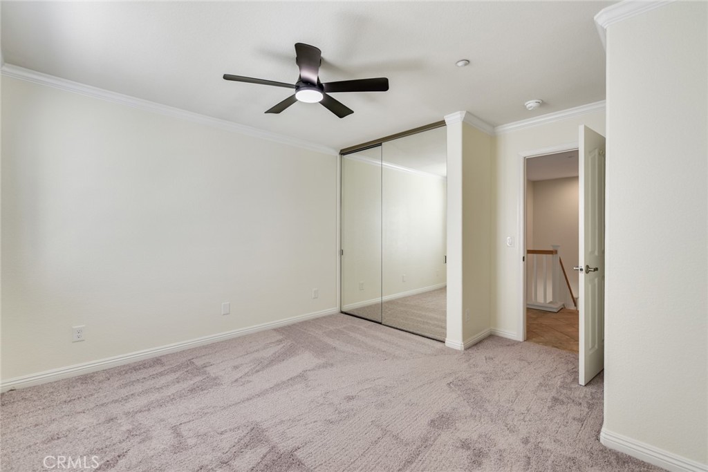 Large mirrored closet in secondary bedroom