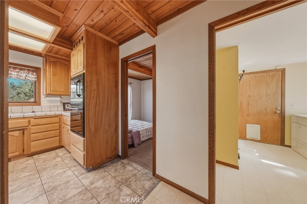 Kitchen, bedroom, and laundry views