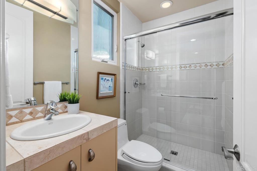 Full bath In bedroom suite with walk in closet