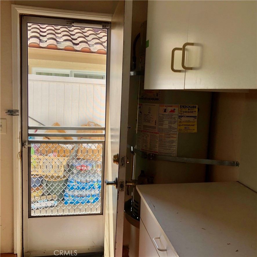 Garage door for easy access and removal of weekly garbage