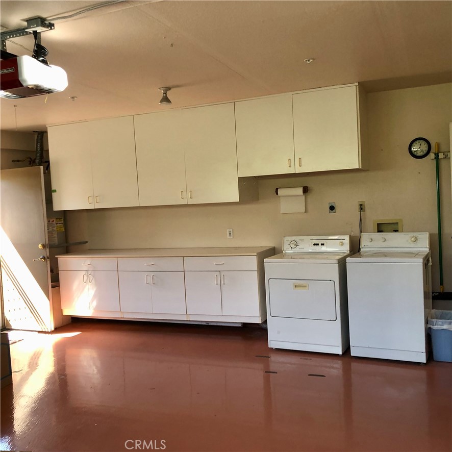 Additional cabinets and washer/dryer in garage