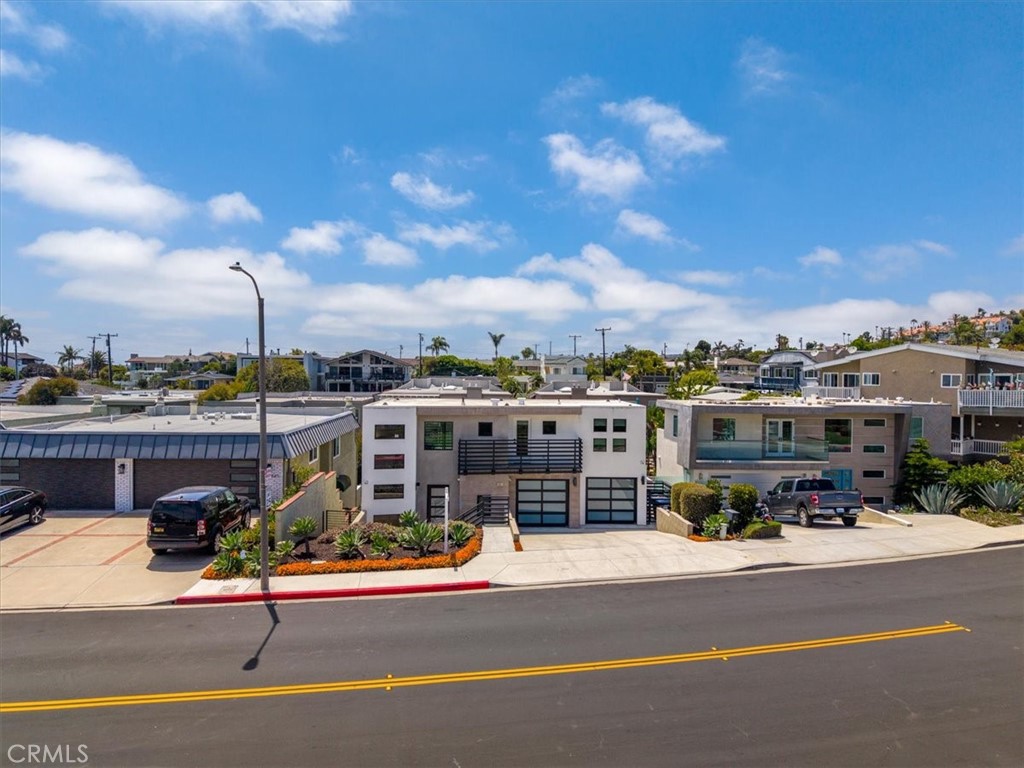 Street view of the neighborhood with coastal views.