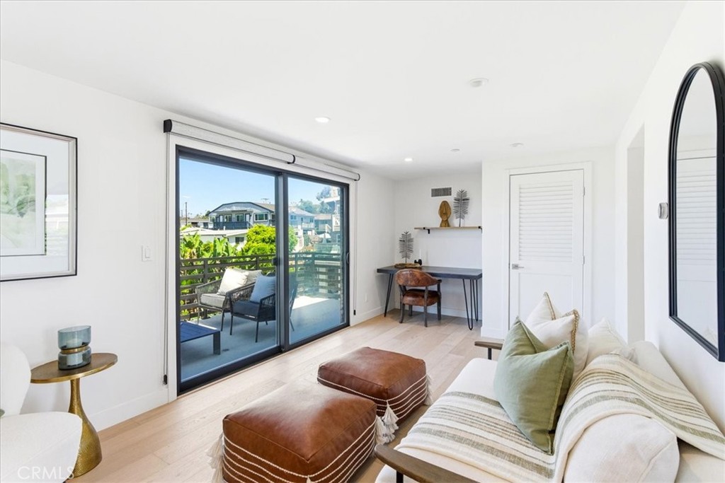 Sitting area with balcony access.