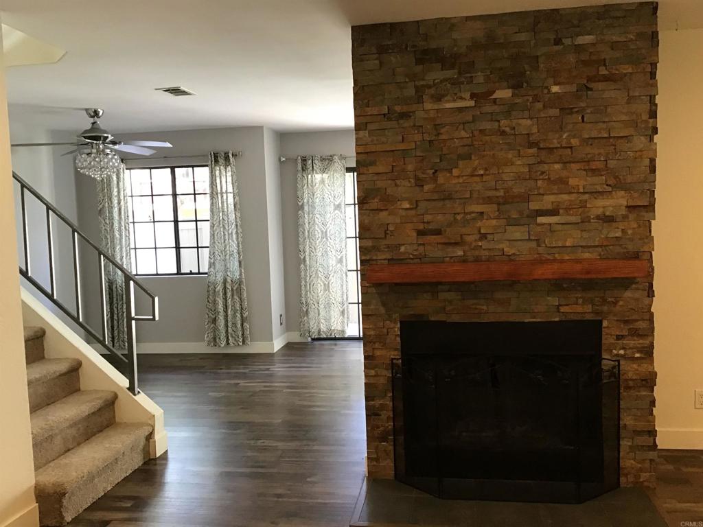 Looking at stairs and into the dinning and kitchen area