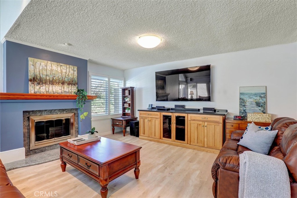 Built-In entertainment center and cozy Fireplace.