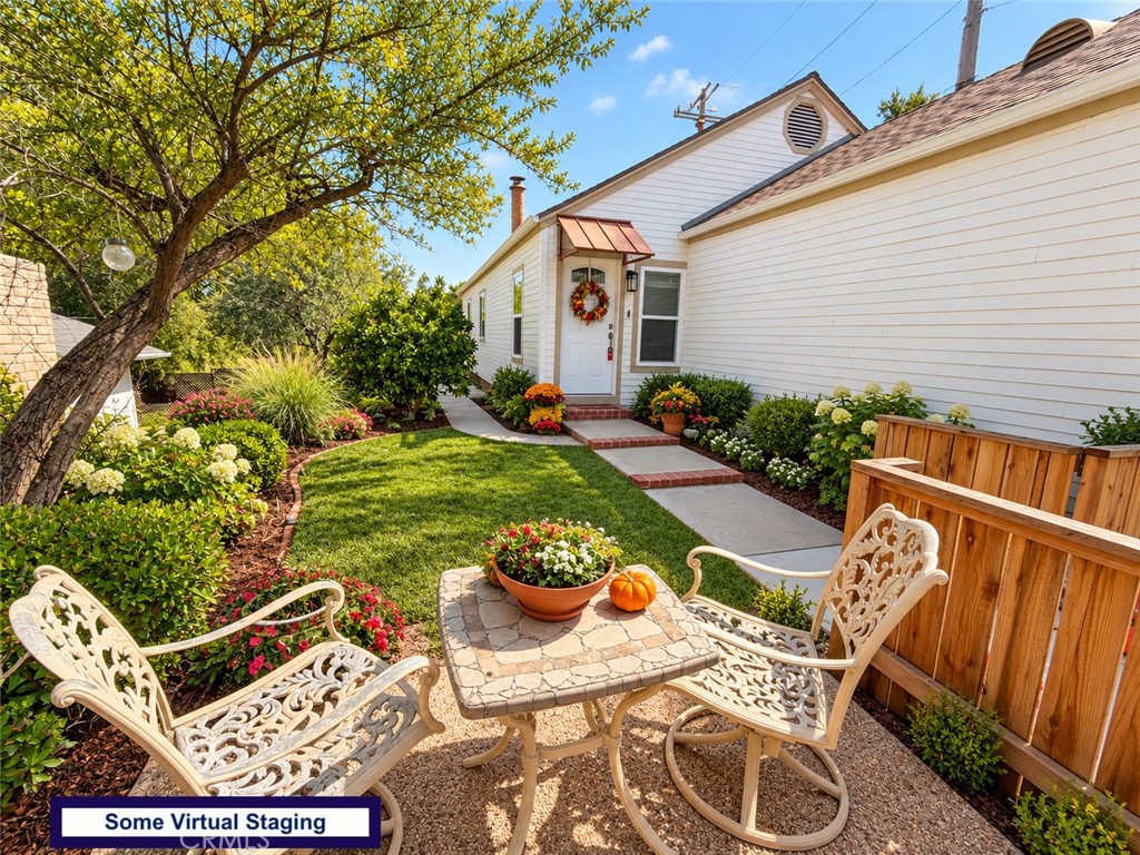 Virtually staged front courtyard - currently has drought landscape
