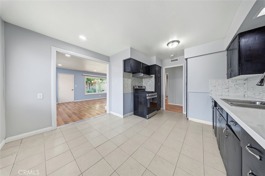 Kitchen is wide with plenty of space ton extend cabinetry - Quartz counters.