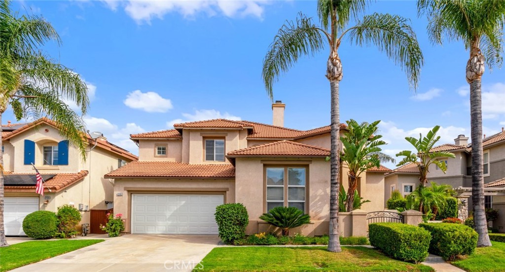 Beautiful Two-Story Home Featuring Attractive Curb Appeal, A Two-Car Garage, Mature Palm Trees, And Beautifully Maintained Landscaping. Beautiful Two-Story Home Featuring Attractive Curb Appeal, A Two-Car Garage, Mature Palm Trees, And Beautifully Maintained Landscaping.