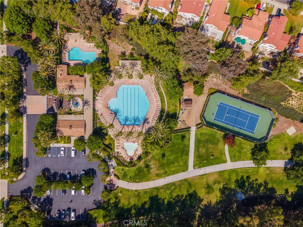 Overhead View Of The Paseo Del Sol Recreation Area Showcasing Sparkling Community Swimming Pools, A Relaxing Spa, Tennis Courts, And Beautifully Landscaped Grounds.