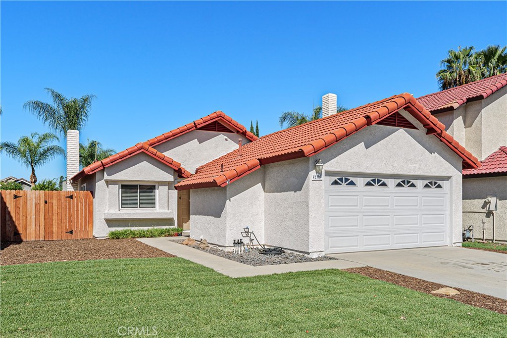 An additional exterior view highlights the home's attractive rooflines, spacious driveway, and welcoming curb appeal. An additional exterior view highlights the home's attractive rooflines, spacious driveway, and welcoming curb appeal.