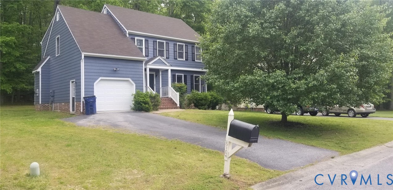 View of front of house featuring driveway, a shingled roof, a garage, and a front lawn View of front of house featuring driveway, a shingled roof, a garage, and a front lawn