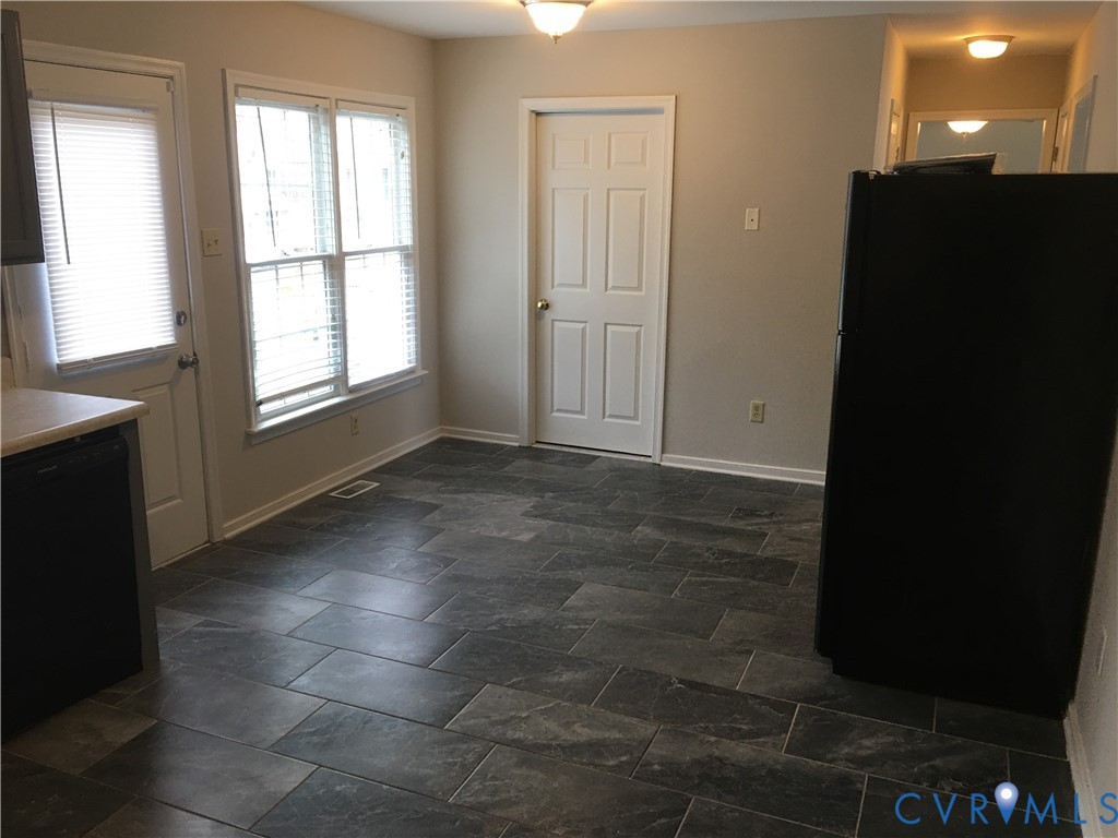 Unfurnished dining area with baseboards Unfurnished dining area with baseboards