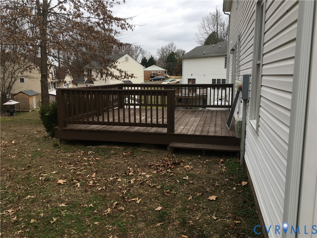 Wooden deck with a residential view