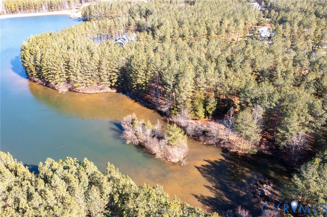 Aerial overview of property's location featuring a large body of water