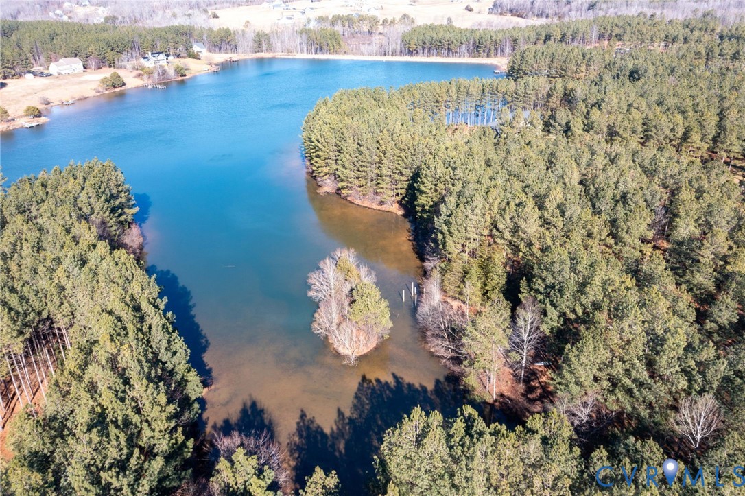 Aerial overview of property's location featuring a nearby body of water