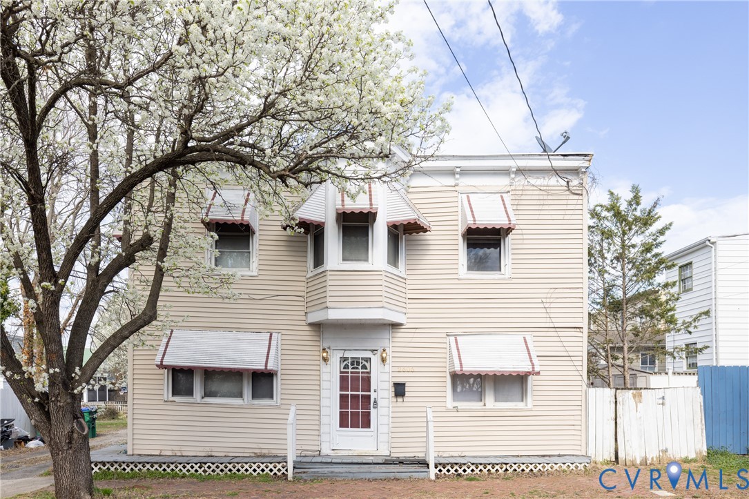 View of front of home with a balcony