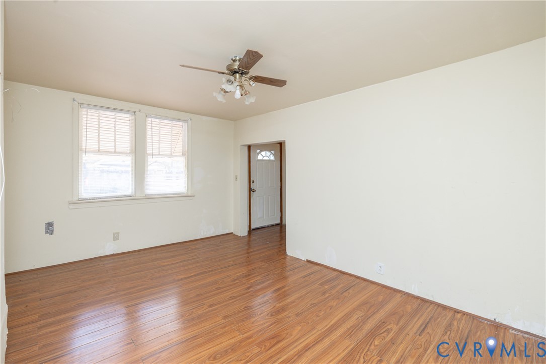 Spare room featuring ceiling fan and wood finished floors Spare room featuring ceiling fan and wood finished floors