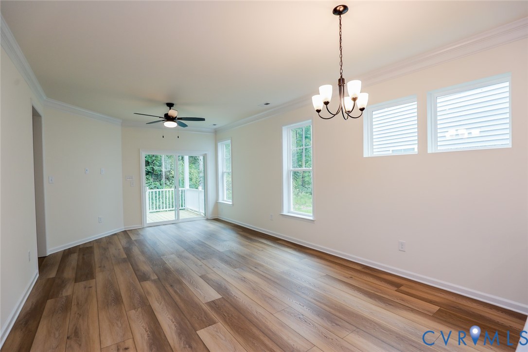 The photo represents the plan, not the actual home. Design selections may vary. The adjoining dining area is open to the light and bright family room.