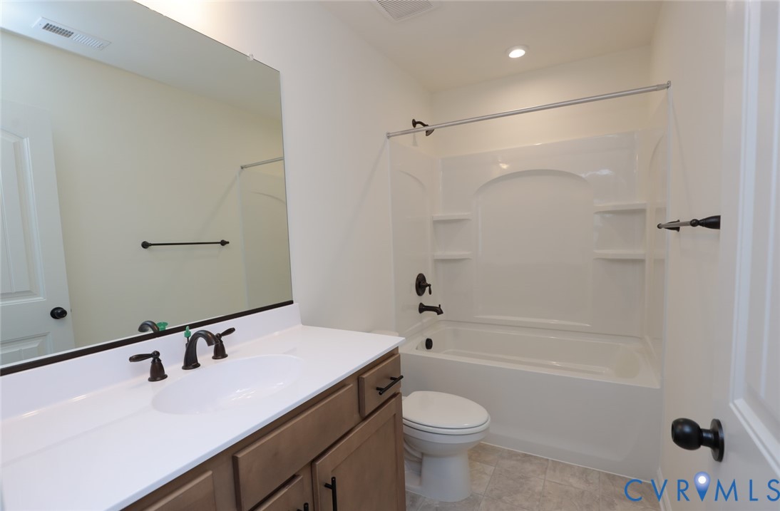 The photo represents the plan, not the actual home. Design selections may vary. Upstairs, youll find three additional bedrooms with double-door closets that share a full hall bath with tub/shower combo.