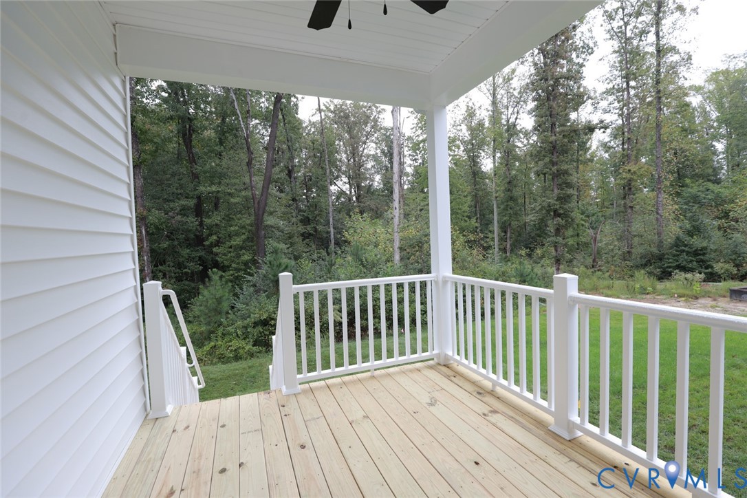 The photo represents the plan, not the actual home. Design selections may vary. A covered porch is situated off of the primary bedroom, perfect for relaxing evenings and morning coffee.