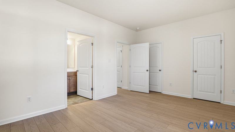 First floor guest suite.This home is under construction. The photo represents the plan, not the actual home. Design selections have been made.