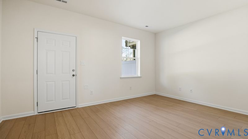 First floor guest suite.This home is under construction. The photo represents the plan, not the actual home. Design selections have been made.