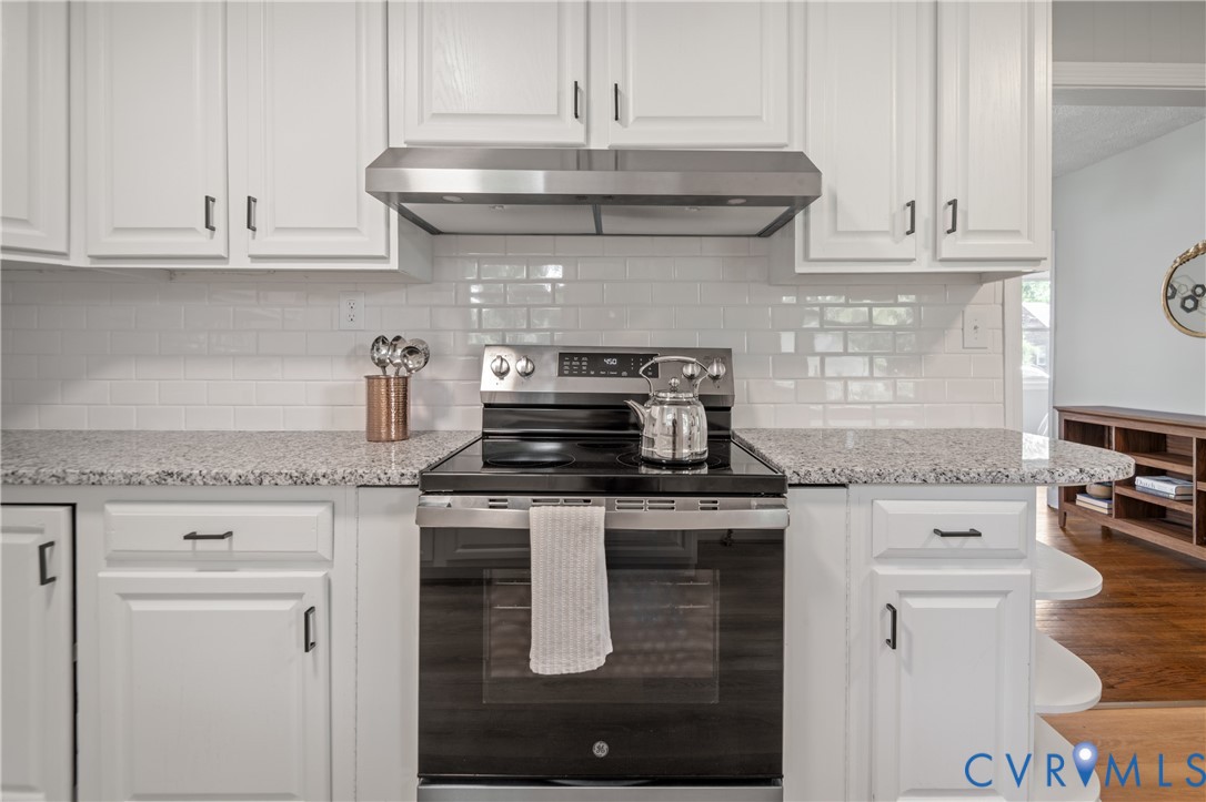 New GE Stainless Steel electric convection range, new hood, new backsplash