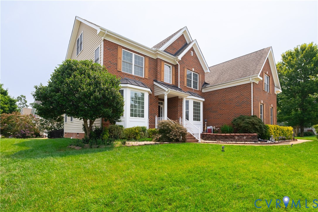 Brick and siding exterior featuring gabled rooflines