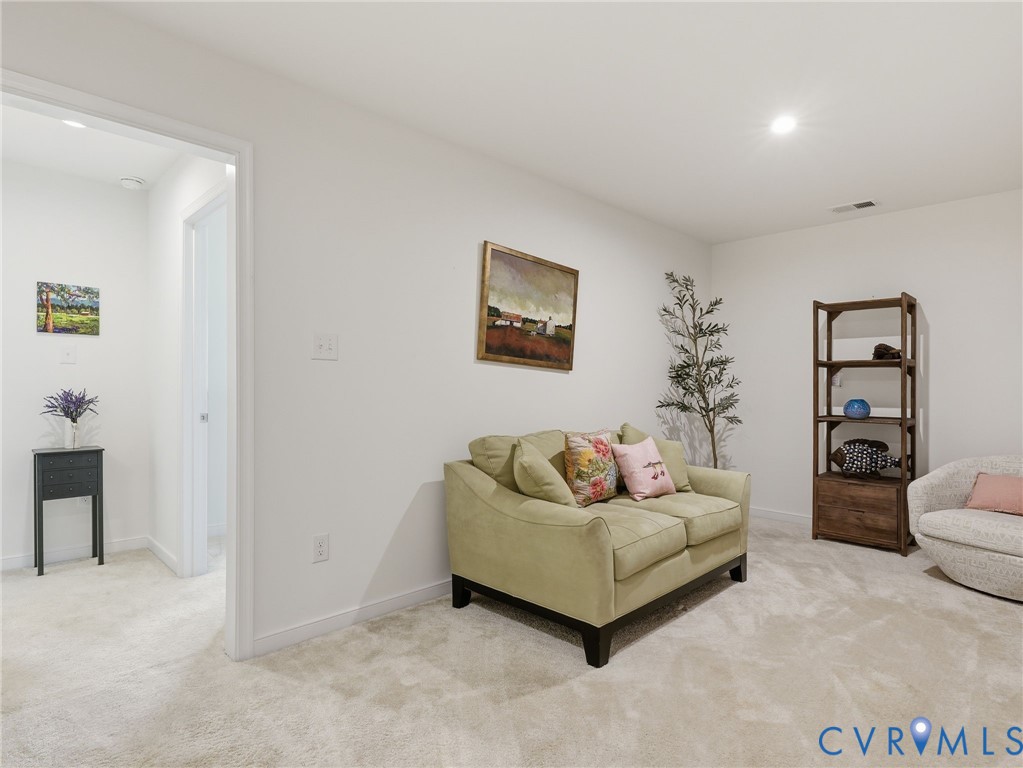 An open loft space designed for whatever your life needs, complete w/plush carpeting & endless possibilities. Whether its a cozy lounge, home office, or playroom, this second-floor loft offers flexible living.