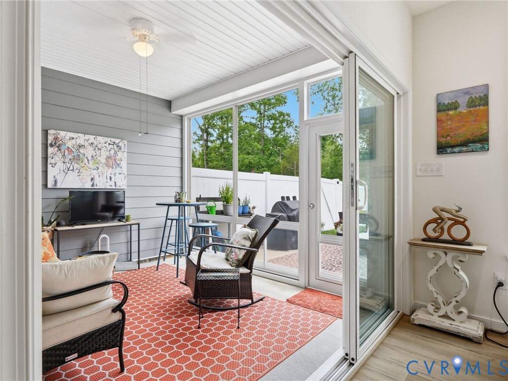 Glass doors open onto itself to create a larger opening. Creates an expanded living space. New ceiling fan. Porch is both glassed & screened for most any season. A space made for living well...