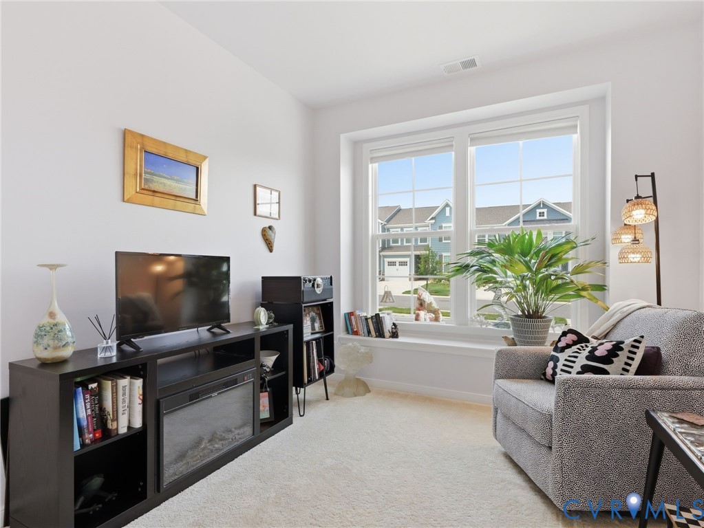 Bedroom # 2 - A peaceful retreat w/lots of natural light. Can be used as an office, sep living space, bedroom, library/reading room, craft room or whatever your imagination can envision. Bright and airy. Plush carpeting. 1st Floor.