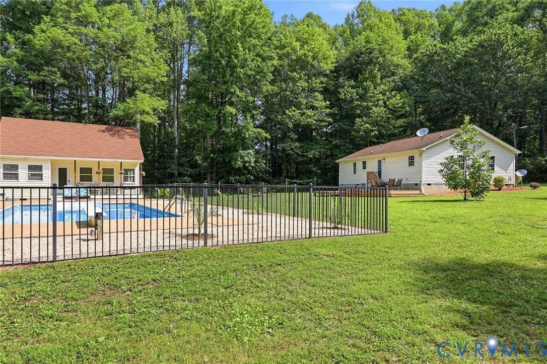 Fenced in-ground pool with screened porch, outdoor shower, poolhouse with covered porch, full bath, space for an office or any number of uses! Fenced in-ground pool with screened porch, outdoor shower, poolhouse with covered porch, full bath, space for an office or any number of uses!