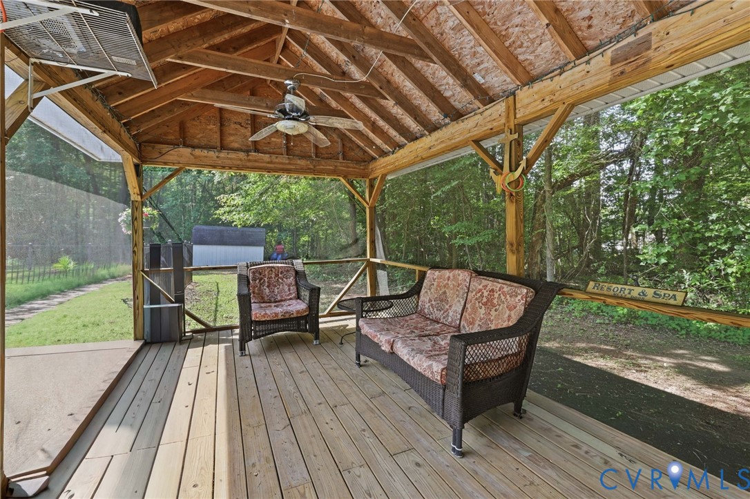 Screened porch just next to the pool: room to relax in the shade.