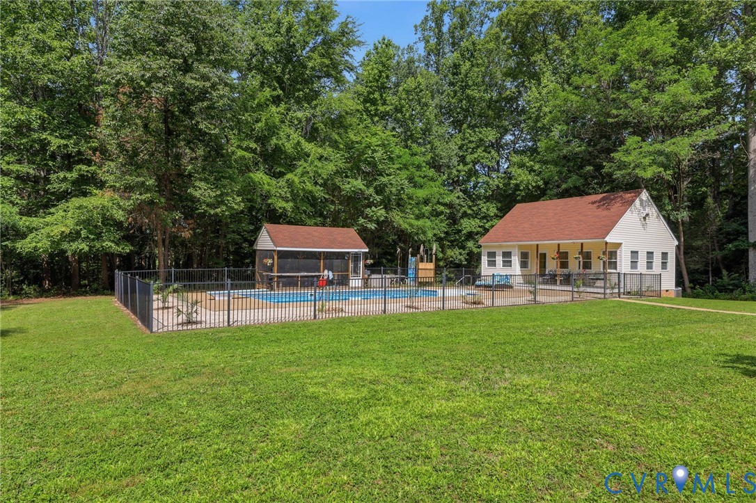 Fenced in-ground pool with screened porch, outdoor shower, poolhouse with covered porch, full bath, space for an office or any number of uses! Fenced in-ground pool with screened porch, outdoor shower, poolhouse with covered porch, full bath, space for an office or any number of uses!
