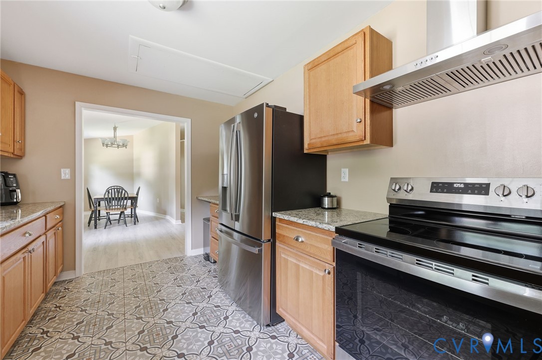 Everything is new in this kitchen: Granite counters, cabinets, ceramic tile flooring appliances!