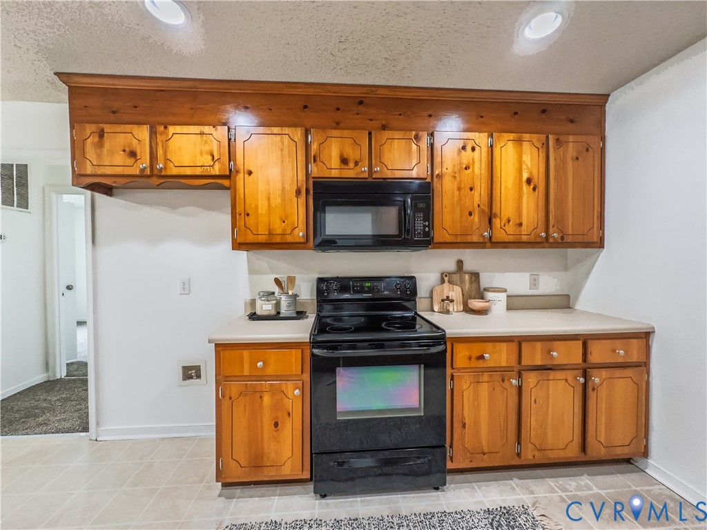 Kitchen, above stove microwave