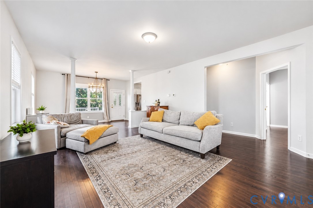 Hardwood-finish flooring, recessed lighting, and a white interior paint palette