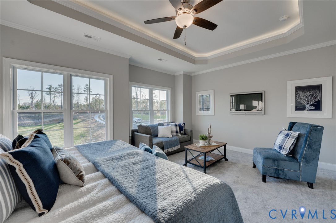 Tray ceiling with recessed lighting and a ceiling fan, light gray wall paint, and white trim