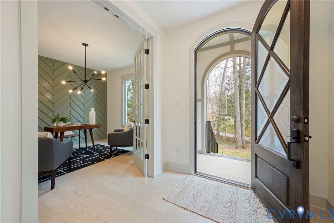 Arched entry door with decorative glass panels and dark wood finish Arched entry door with decorative glass panels and dark wood finish
