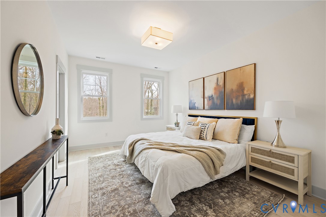 Bedroom 3, 2nd floor with light wood-flooring, closet & light fixture