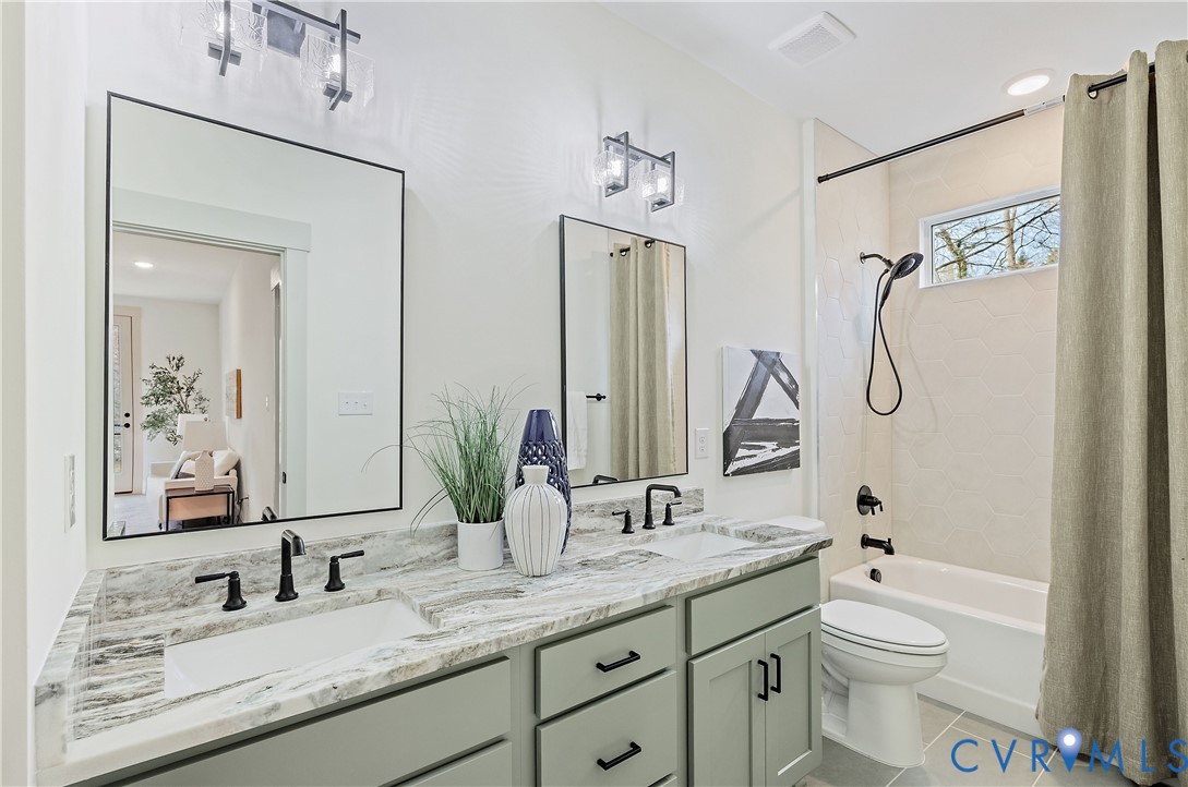 Full hall bathroom on the 2nd floor. Double vanity with stone countertop and tub/shower combo