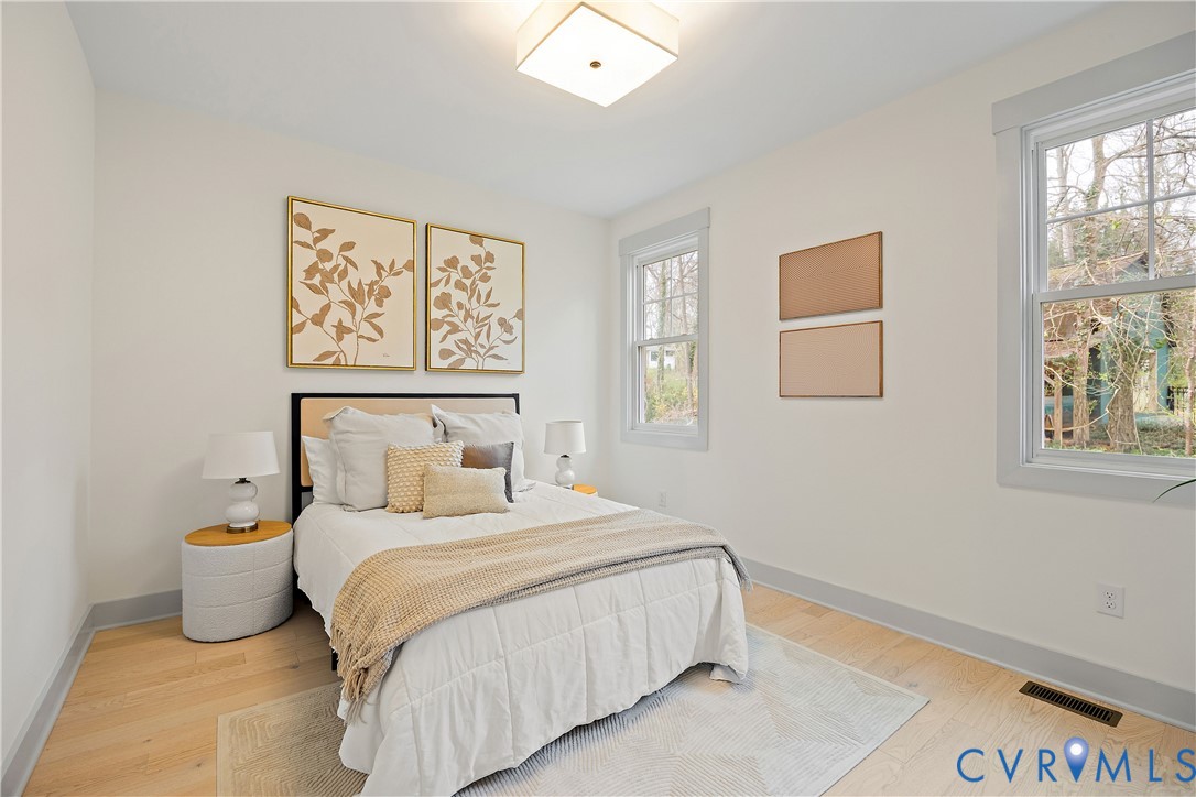 Bedroom 4, 1st floor with light wood-flooring & closet