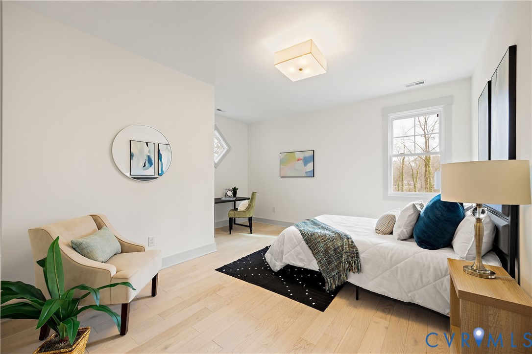 Bedroom 2, 2nd floor. Light wood-finish flooring throughout