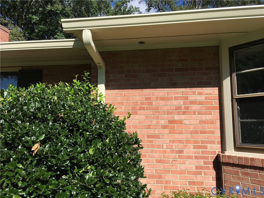 New Large Gutters and Downspouts  and Drainage Piping from Downspouts to front and rear property lines
