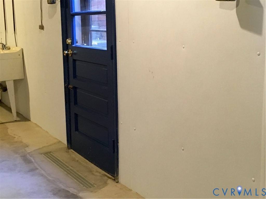 Metal Grate at Lower Level Door