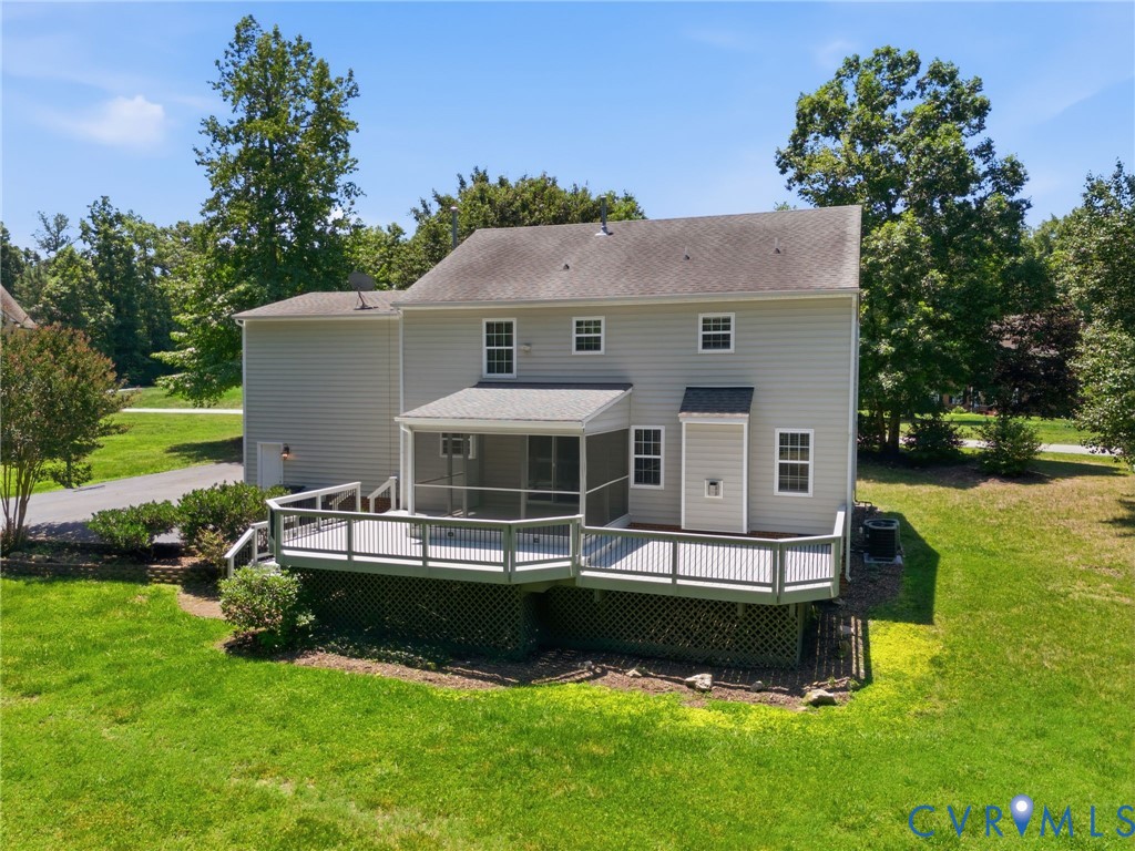 Rear exterior featuring a large multi-level deck, screened porch, light gray siding, and a shingled roof