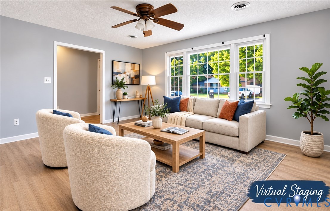 Living area featuring wood-finish flooring, a ceiling fan, and recessed lighting